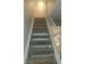 Carpeted staircase featuring a white railing at 4310 Lynnann Dr, Las Vegas, NV 89110