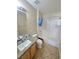 This inviting bathroom features a granite countertop and shower-tub combo at 451 Rumford Pl, Henderson, NV 89074