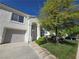 Charming home featuring a well-maintained front lawn and attached garage at 451 Rumford Pl, Henderson, NV 89074