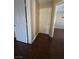 Hallway with multiple doors and laminate wood flooring at 451 Rumford Pl, Henderson, NV 89074