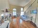 Bright living room featuring hardwood floors, a fireplace, and lots of natural light at 451 Rumford Pl, Henderson, NV 89074