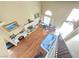 A high angle of the living room, showing the staircase, floors and decor at 451 Rumford Pl, Henderson, NV 89074