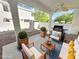 Outdoor patio area perfect for entertaining, with comfortable seating, a grill, and serene ambiance at 451 Rumford Pl, Henderson, NV 89074