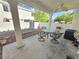 A covered patio includes a ceiling fan, seating area, and low-maintenance landscaping at 451 Rumford Pl, Henderson, NV 89074