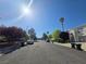 A quiet residential street with well-maintained homes and mature trees on a sunny day at 451 Rumford Pl, Henderson, NV 89074
