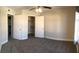 This bedroom is spacious with a large walk-in closet, neutral carpet, and white trim at 4555 E Sahara Ave # 226, Las Vegas, NV 89104