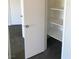 View of a white, walk-in closet, complete with shelving and ample storage space at 4555 E Sahara Ave # 226, Las Vegas, NV 89104