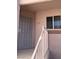 Front entryway featuring security door, stairway, and window at 4555 E Sahara Ave # 226, Las Vegas, NV 89104