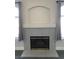 Close up of the stone fireplace, flanked by windows with gray curtains at 4555 E Sahara Ave # 226, Las Vegas, NV 89104