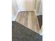 Close-up of the floor showcasing where the planking joins the plush gray carpet at 4555 E Sahara Ave # 226, Las Vegas, NV 89104