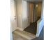 Hallway with plank flooring and carpet, showcasing the transition between spaces at 4555 E Sahara Ave # 226, Las Vegas, NV 89104