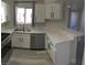 Bright kitchen boasts stainless steel appliances, white cabinets, and stone countertops at 4555 E Sahara Ave # 226, Las Vegas, NV 89104