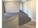 Open-concept living space with fresh gray carpet, open flow and bright neutral walls at 4555 E Sahara Ave # 226, Las Vegas, NV 89104