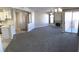 Bright living room featuring fireplace, neutral decor, and sliding glass doors to the patio at 4555 E Sahara Ave # 226, Las Vegas, NV 89104