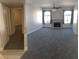 Spacious living room featuring carpeted floors and fireplace at 4555 E Sahara Ave # 226, Las Vegas, NV 89104