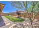 Large backyard featuring desert landscaping, privacy fence, and a walkway at 508 Cadence View Way, Henderson, NV 89011