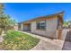 Well-manicured backyard featuring a covered patio and low-maintenance landscaping at 508 Cadence View Way, Henderson, NV 89011