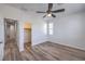Bedroom features wood-look floors, closet, and a bright window at 508 Cadence View Way, Henderson, NV 89011