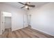 Bedroom features wood-look floors, a ceiling fan, and closet at 508 Cadence View Way, Henderson, NV 89011