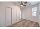 This bedroom features wood-look floors, a ceiling fan, and closet at 508 Cadence View Way, Henderson, NV 89011