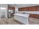 Modern kitchen with stainless steel appliances, white countertops, and a large center island at 508 Cadence View Way, Henderson, NV 89011