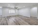 Spacious living room with wood-look floors, recessed lighting and lots of natural light at 508 Cadence View Way, Henderson, NV 89011