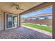 Covered patio with brick flooring and a ceiling fan, providing a cozy outdoor space at 508 Cadence View Way, Henderson, NV 89011