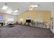 Large amenity room with a fireplace, bookshelves, tables, and seating at 5109 Midnight Oil Dr, Las Vegas, NV 89122