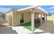 Backyard featuring a covered patio and an artificial grass area at 5109 Midnight Oil Dr, Las Vegas, NV 89122