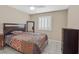 Bedroom featuring neutral walls, tiled floors, white shutters, and ceiling fan at 5109 Midnight Oil Dr, Las Vegas, NV 89122