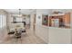 Bright dining area with tile floors, breakfast bar, and connections to the kitchen and living room at 5109 Midnight Oil Dr, Las Vegas, NV 89122