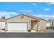 Charming single-story home with a two-car garage, desert landscaping and a neutral color scheme at 5109 Midnight Oil Dr, Las Vegas, NV 89122