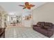 Spacious living area with tile flooring, open to the dining area, perfect for entertaining at 5109 Midnight Oil Dr, Las Vegas, NV 89122