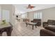 Comfortable living room with tile flooring, plantation shutters, and an open floor plan at 5109 Midnight Oil Dr, Las Vegas, NV 89122