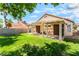 Relax on the covered patio in this backyard, perfect for outdoor entertaining at 5725 Cedar Ave, Las Vegas, NV 89110