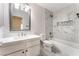 Modern bathroom featuring white marble, a soaking tub and a framed mirror at 5725 Cedar Ave, Las Vegas, NV 89110