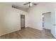 This bedroom features vaulted ceilings, wood floors, and an attached bathroom at 5725 Cedar Ave, Las Vegas, NV 89110