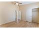 This spacious bedroom boasts a ceiling fan, wood floors, and two separate closets at 5725 Cedar Ave, Las Vegas, NV 89110
