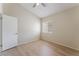 Bright bedroom with wood floors, a window with blinds, and ample natural light at 5725 Cedar Ave, Las Vegas, NV 89110