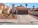 Charming single-story home with a two-car garage and desert landscaping at 5725 Cedar Ave, Las Vegas, NV 89110