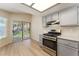 Kitchen featuring stainless steel appliances and gray cabinets at 5725 Cedar Ave, Las Vegas, NV 89110