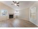 Bright living room features a fireplace, ceiling fan, and natural light at 5725 Cedar Ave, Las Vegas, NV 89110