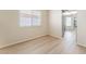 Bright living room with light hardwood floors and natural lighting at 5725 Cedar Ave, Las Vegas, NV 89110