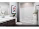 Bright bathroom with a shower over bath, stylish vanity with solid surface top, and framed art at 620 Bellus Pl # Lot 168, Henderson, NV 89015