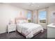 Bedroom with plush carpet, a ceiling fan, and a large window with views of the surrounding landscape at 620 Bellus Pl # Lot 168, Henderson, NV 89015