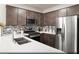 Modern kitchen featuring stainless steel appliances, mosaic backsplash, and white countertops at 620 Bellus Pl # Lot 168, Henderson, NV 89015