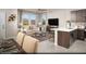 Bright living room featuring open floor plan, barstool seating, and an adjacent kitchen at 620 Bellus Pl # Lot 168, Henderson, NV 89015