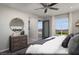 Spacious primary bedroom features plush carpeting, ceiling fan, and balcony access at 620 Bellus Pl # Lot 168, Henderson, NV 89015