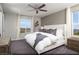 Spacious primary bedroom featuring plush carpeting, ceiling fan, and mountain views at 620 Bellus Pl # Lot 168, Henderson, NV 89015
