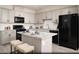 Modern kitchen with granite countertops, stainless steel appliances, a kitchen island with seating, and ample cabinet space at 624 Bellus Pl # Lot 170, Henderson, NV 89015